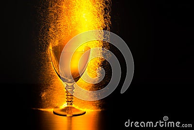 Wine Goblet with Erupting Sparks Stock Photo