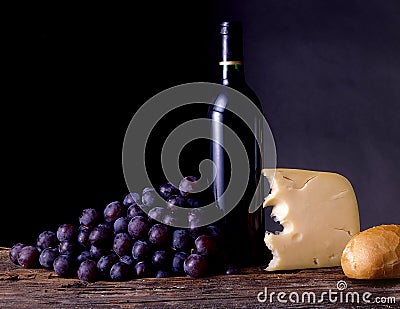 Wine, grapes, cheese and bread Stock Photo