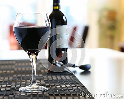 Wine poured in glass at home Stock Photo