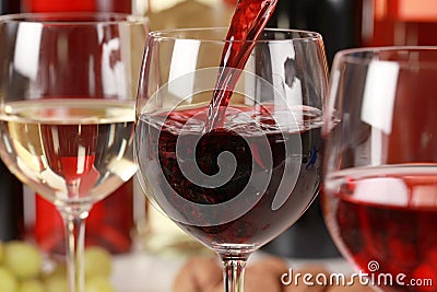 Wine pouring into a wine glass Stock Photo