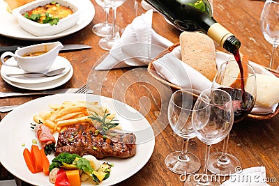 Wine with restaurant food plate Stock Photo