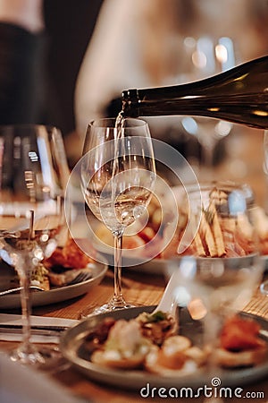 Wine tasting experience in the rustic cellar and wine bar: red wine glass and collection of excellent wines on the Stock Photo