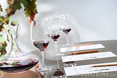 Wine tasting table set with decanter and glasses. Stock Photo