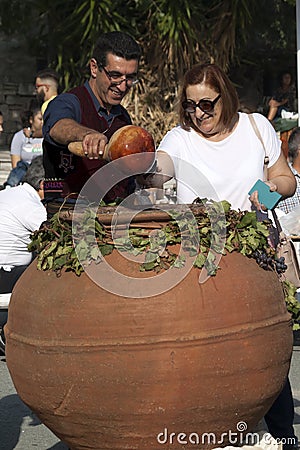Wine tasting from a traditional barrel in Koilani village, Cyprus Editorial Stock Photo