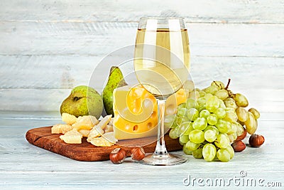 Wineglass white wine with fruits nut Stock Photo