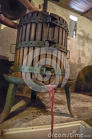 Winemaking. Old wooden wine press with must inside. Pressing of Stock Photo