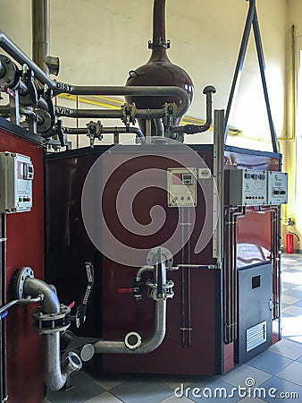 Distillation apparatus used to distill alcohol and moonshine in a winery. Editorial Stock Photo