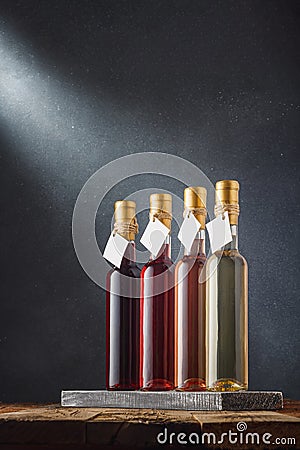 Wines assortment. Several 250 ml bottles of red, pink, white dry dessert wines with blank labels, mockup template. Vertical shot. Stock Photo