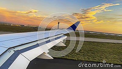 Wing of an aircraft retracting the aircraft flaps after landing at Paris-Charles de Gaulle Airport for landing Stock Photo