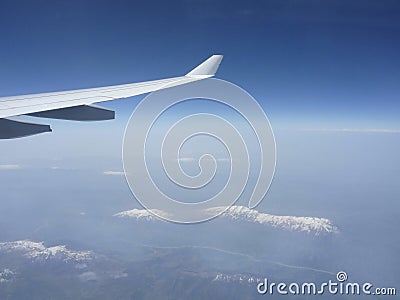 Wing over mountain Stock Photo