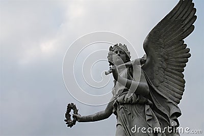 Winged female angel sculpture Stock Photo