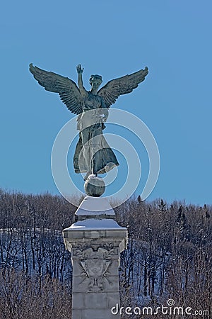 Statue winged Goddess of Liberty in front of Mont Royal, Montreal Editorial Stock Photo