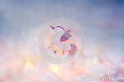 A Winged unicorn or an Alicorn on the clouds. Stock Photo