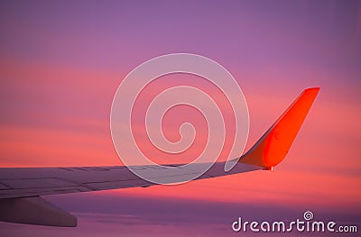 Wings Airplane with sky pastel sunset. flight view from window airplane Stock Photo