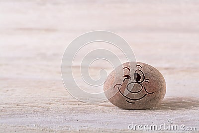 Winking face emoticon Stock Photo