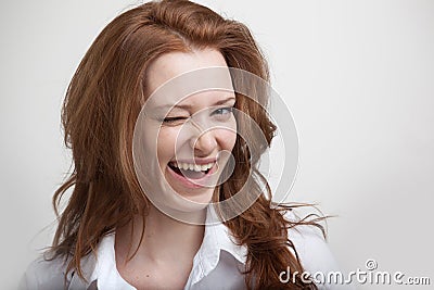 Winking. Girl winking into the camera Stock Photo