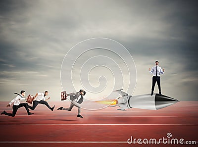 Winner businessman over a fast rocket. Concept of business competition Stock Photo