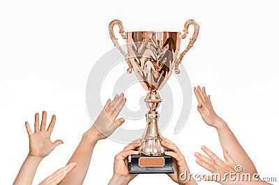 Winner is holding trophy in hands - many hands raised up Stock Photo
