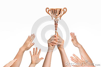 Winner is holding trophy in hands - many hands raised up Stock Photo