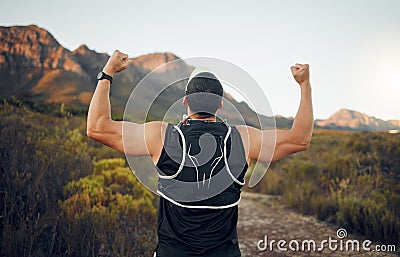 Winner, mountain and runner man success with back view celebrating cardio exercise goal victory. Muscular, strong and Stock Photo