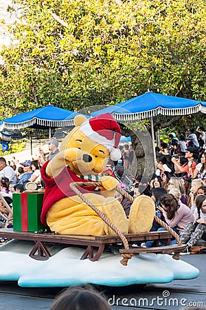 Winnie the Pooh rides a sleigh in Disneyland Parade Editorial Stock Photo