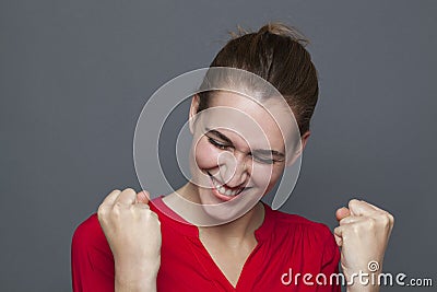 Winning behavior concept for energetic 20s girl Stock Photo