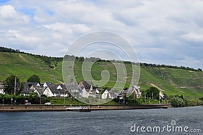 Winningen, Germany - 06 25 2020: waterfront with a ship jetty Editorial Stock Photo