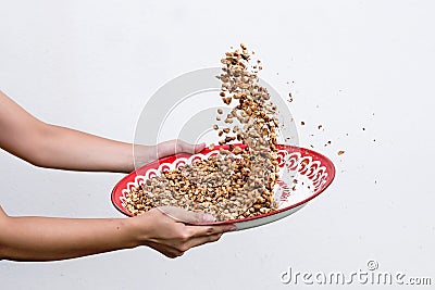 Winnow roasted peanuts on gray wall background Stock Photo