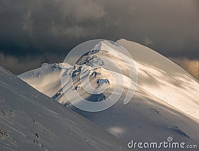 Winter alpine landscape, huge amount of blown snow, danger of snow avalanche. Stock Photo