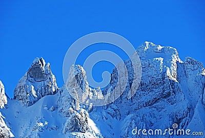 Winter ambience and beautiful idyllic atmosphere on the steep alpine rocky peak Schwarzchopf / 1950 m.a.s.l. / and the Alpstein Stock Photo