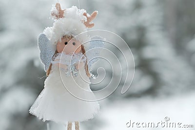 Winter angel.Christmas and New Years time.Christmas angel on a tree. Christmas tree toy. Stock Photo