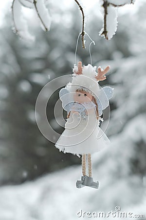 Winter angel.Christmas angel on a tree. Snow fairy. Christmas tree toy. Stock Photo