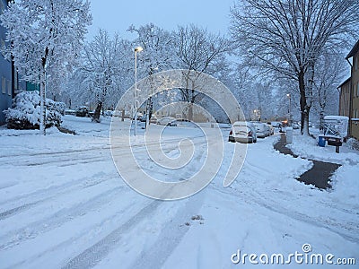 Winter attack in Germany. Heavy snowfall in NRW in the Mettmann county. Snow-covered roads and cars Editorial Stock Photo