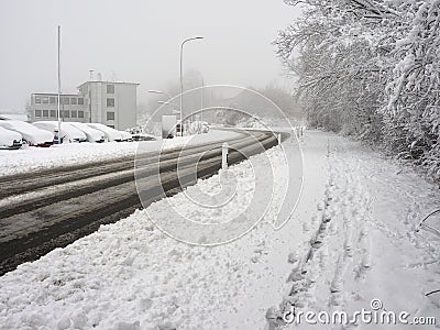Winter attack in Germany. Heavy snowfall in NRW in the Mettmann county. Snow-covered roads, sidewalks and cars Editorial Stock Photo