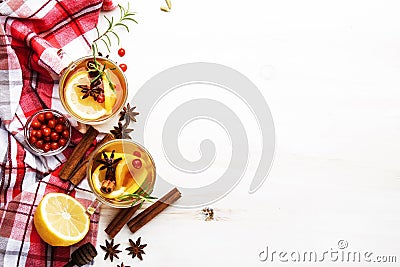 Winter autumn warming hot tea with lemon, cranberries and spices, white background, copy space, top view Stock Photo