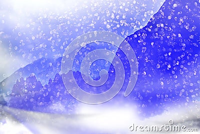 Winter background. Falling snow in the mountains. Stock Photo