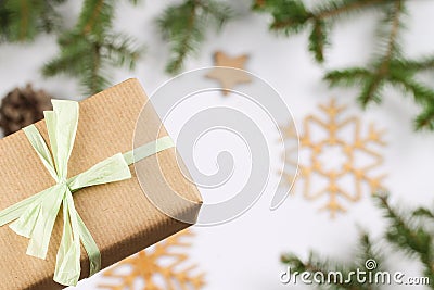 Winter background with gift box, fir branches and snowflakes. Stock Photo