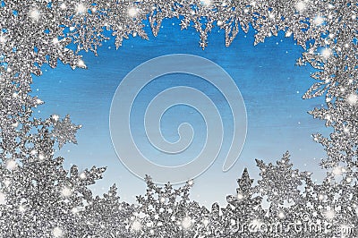 Winter background with silver snowflakes Stock Photo