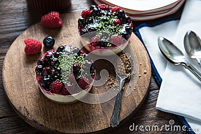 Winter berry fruits cheesecake with pistachio Stock Photo