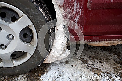 Clogged with Snow and Ice Wheel Well Liner Stock Photo