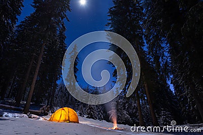 Winter camping with fire Stock Photo