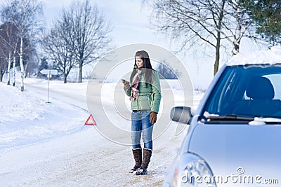Winter car breakdown - woman call for help Stock Photo