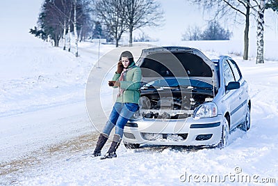 Winter car breakdown - woman call for help Stock Photo