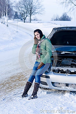 Winter car breakdown - woman call for help Stock Photo