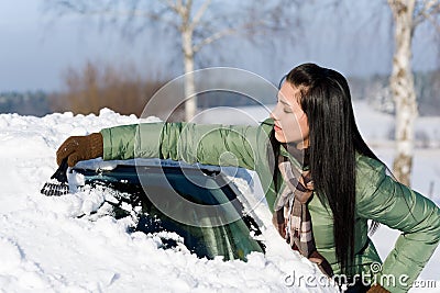 Winter car - woman remove snow from windshield Stock Photo