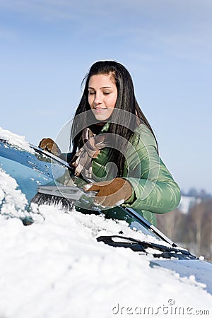 Winter car - woman remove snow from windshield Stock Photo