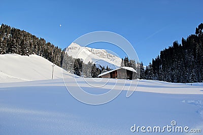 Winter Chalet House at the Mountains in Lech am Arlberg, Austrian Alps Stock Photo