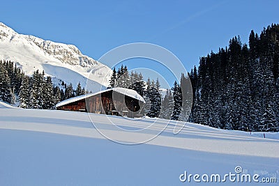 Winter Chalet House at the Mountains in Lech am Arlberg, Austrian Alps Stock Photo