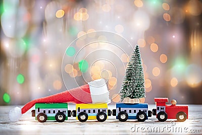 Winter Christmas background Miniature colorful train with fir tree. Holiday greeting card Stock Photo