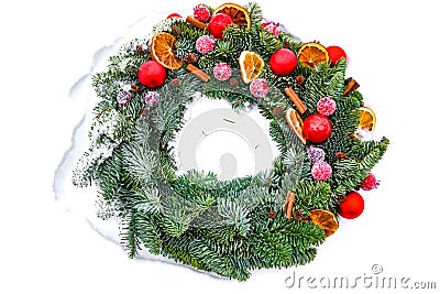 Winter christmas conifer wreath on snow, isolated Stock Photo